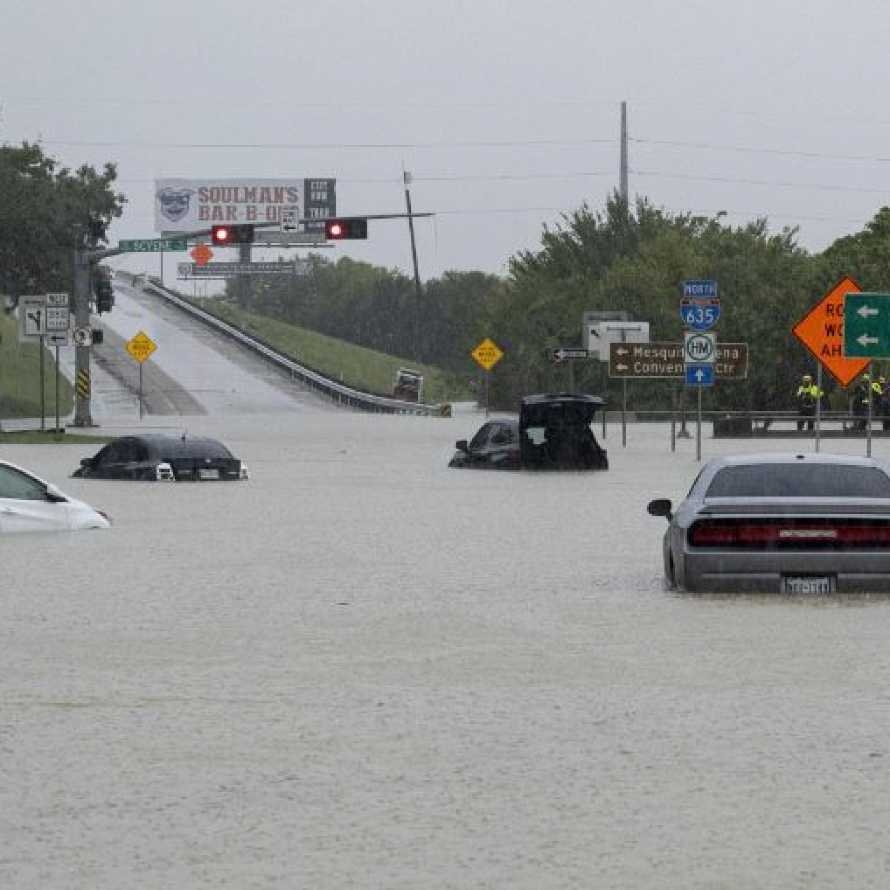 Heavy rain floods streets across the Dallas-Fort Worth area