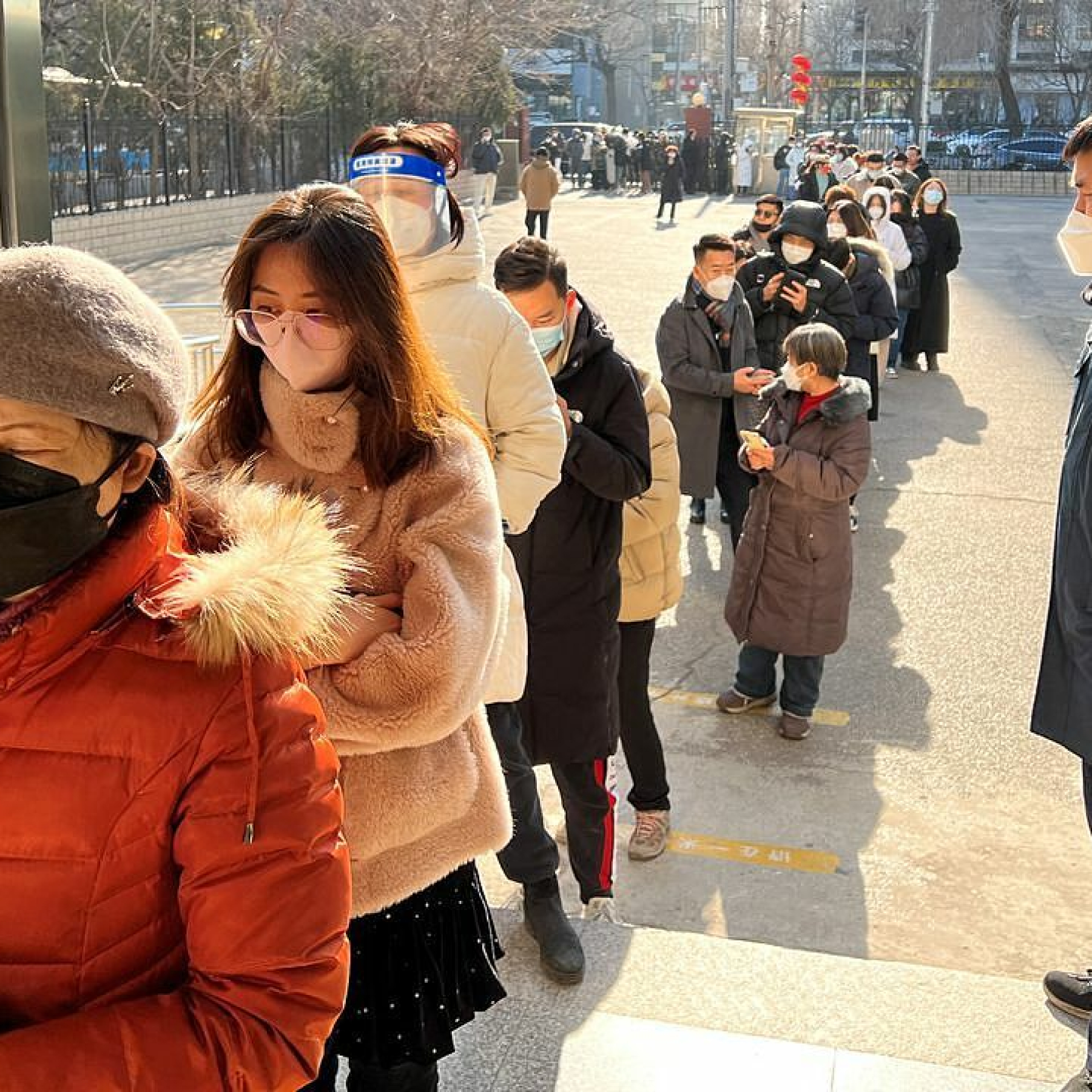 There are long queues at offices issuing passports and permits to travel to Hong Kong