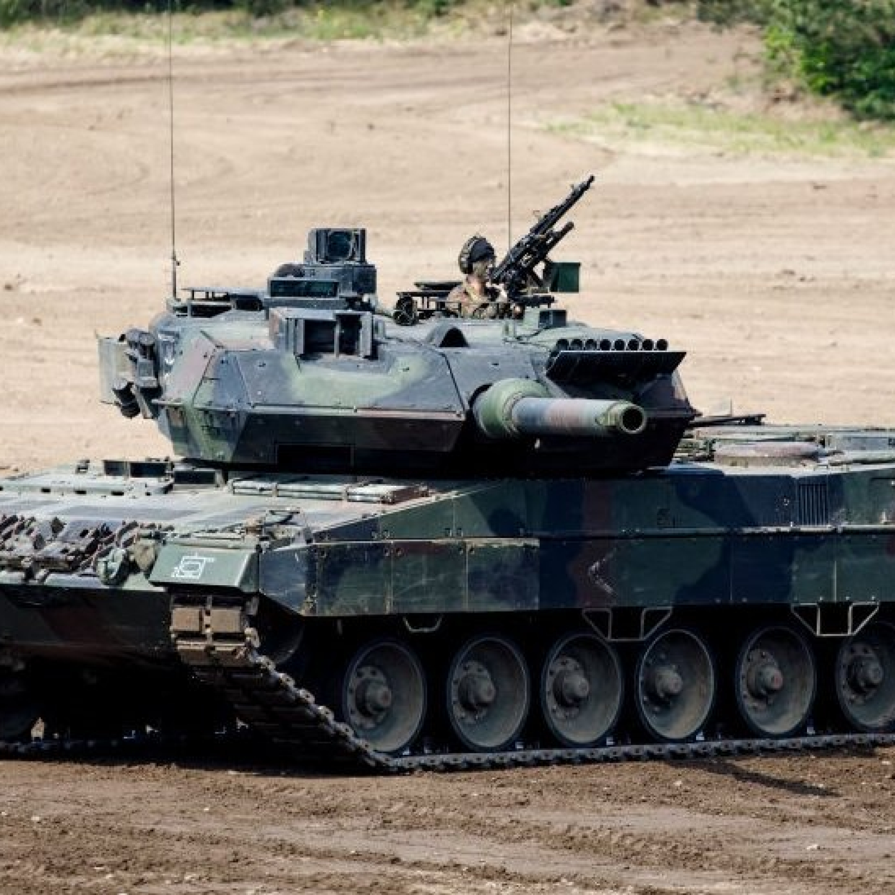 German Chancellor Olaf Scholz - pictured last year - was under international pressure to send Leopard 2s
