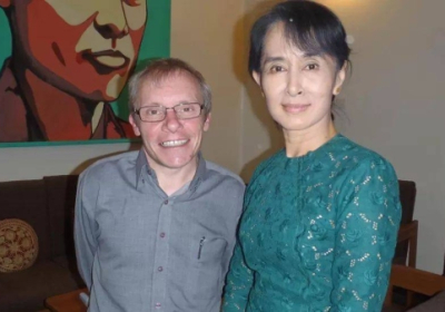 Sean Turnell (left) was convicted of security breaches along with Myanmar's former leader Aung San Suu Kyi (right)
